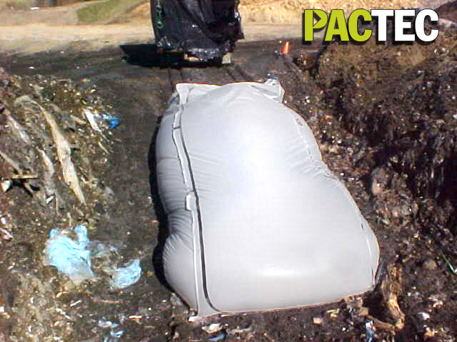 [E] TransPac- Waste Bag Dropped Into Landfill